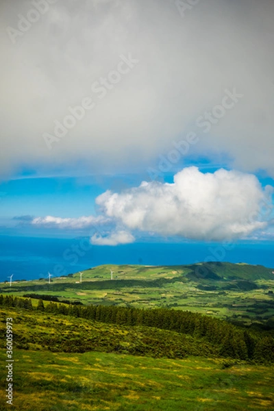 Fototapeta Beautiful green landscapes along the ocean in Faial island, Azores, Portugal and the view to Pico island and the mountain