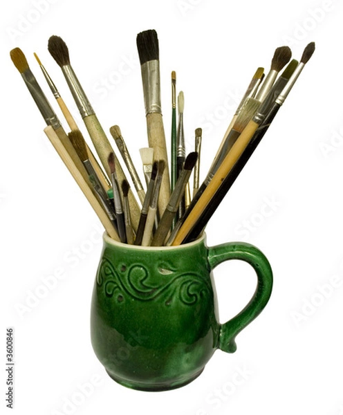 Fototapeta paint brushes in a jug. isolated on white.