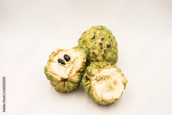 Obraz Three custard apples placed on a white ground.