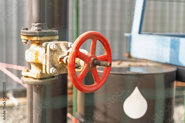 Fototapeta red crane on oil rig close up