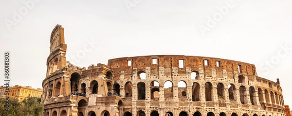 Obraz Rome Italy. Exterior of the Colosseum, famous for shows with gladiators in the Roman Empire, inserted in the new seven wonders of the world. Detail of the typical architectural arches and friezes.