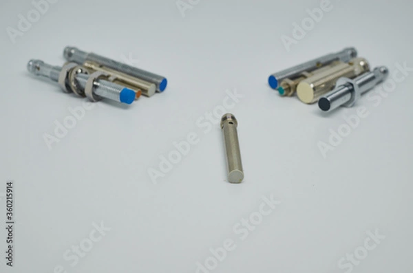 Obraz Many Inductive proximity sensor or proximity switch on a white background.