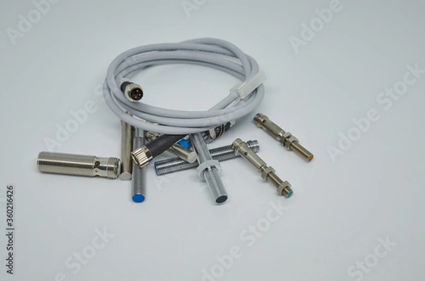 Obraz Many Inductive proximity sensor or proximity switch on a white background.