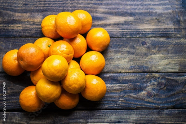 Obraz many oranges on wooden background