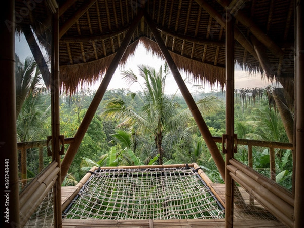 Fototapeta Bamboo balcony with hammock of the tropical tree house.