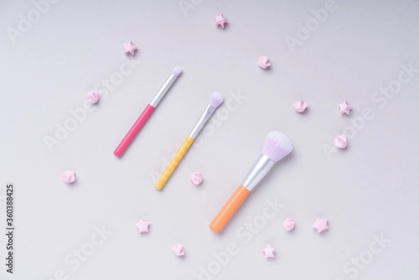 Fototapeta Top view - Rainbow pastel colourful brushes over bright colour background.