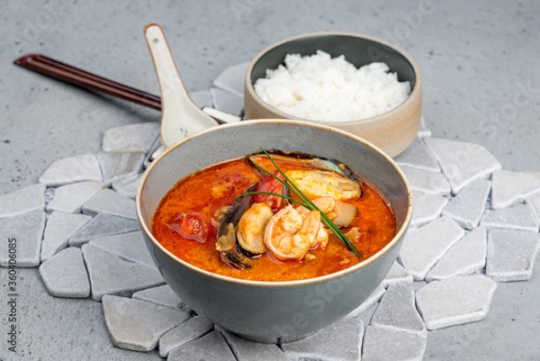 Fototapeta Tom Yam soup with a separate bowl of rice