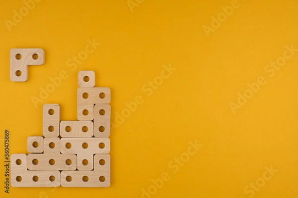 Fototapeta Children's wooden toy sorter close up with copy space. Concept of educational games and tetris. Copy space