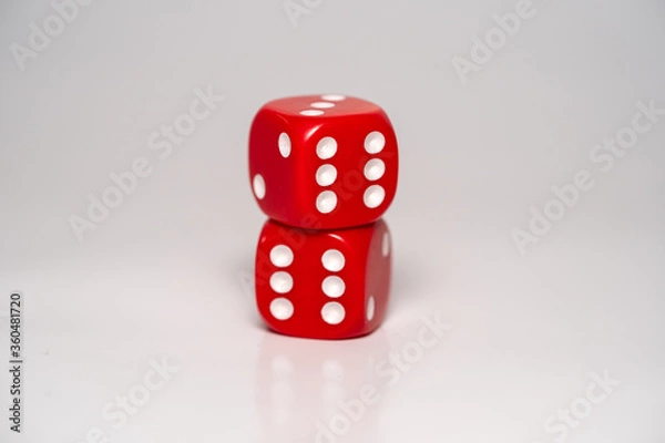 Fototapeta two red dices on a white background