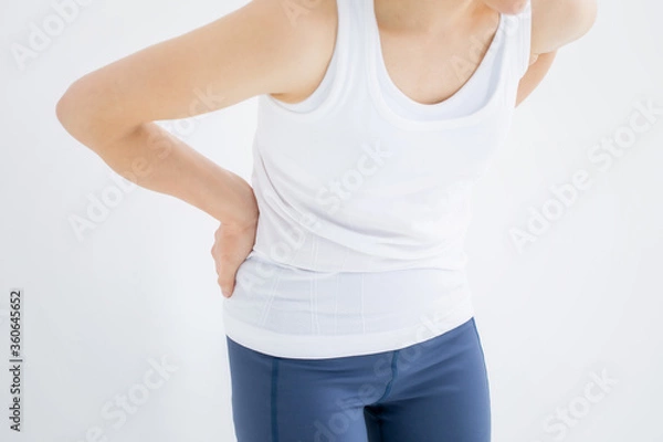 Fototapeta 腰をおさえる女性
