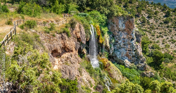 Obraz Hiking track over waterfall with blurred tourists