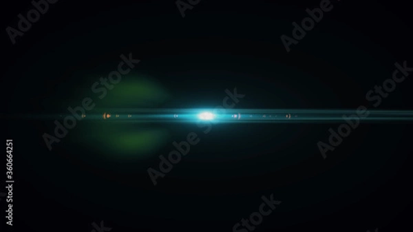 Fototapeta Anamorphic lens flare from a photo camera lens. Anamorphic background.