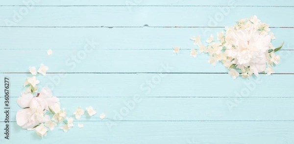 Fototapeta white flowers on white wooden background