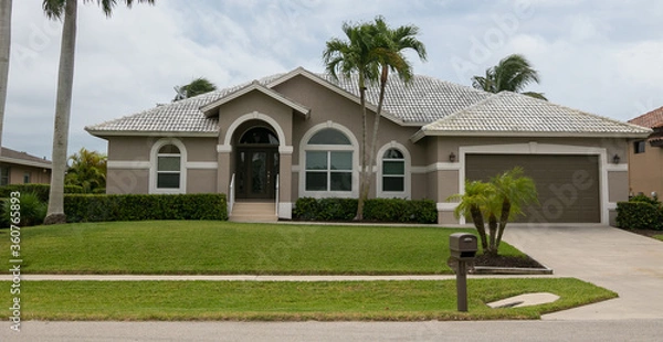 Fototapeta Typical private home at an affluent residential area on Marco Island, Florida.