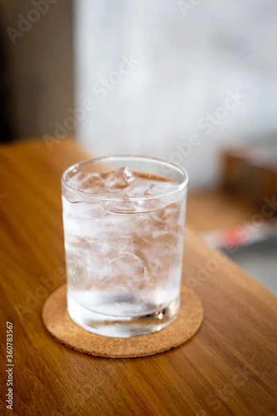Obraz A glass of cold drinking water on wooden table