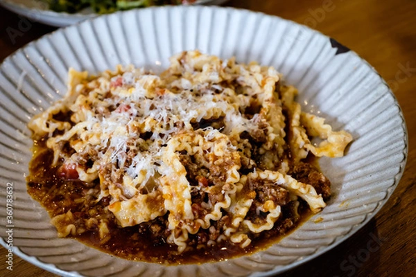 Fototapeta Reginette pasta with pork Bolognese sauce