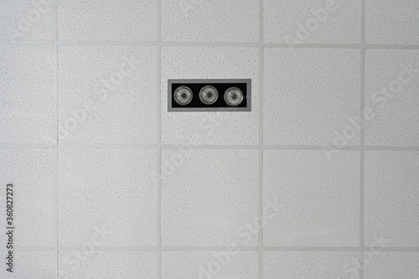 Fototapeta Photo of the ceiling in a building with lighting and alarm elements