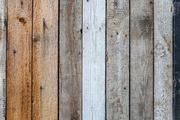 Fototapeta The texture of wooden boards. Vertical stripes. Background. Space for text.
