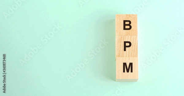 Fototapeta black letters bpm on wooden blocks and space for design