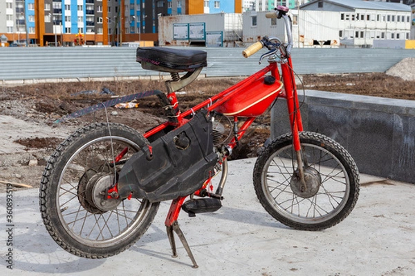 Fototapeta Restored Bicycle with a motor, red moped, manufactured in the Soviet Union