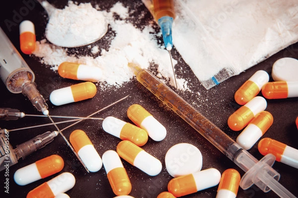 Fototapeta Drug abuse Concept. Opioid epidemic .Opioid Pills. Syringe preparation spoon and prepared the heroin. Stop the use of drugs.