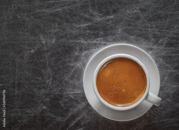 Fototapeta Top view a cup of espresso coffee on silvery background with copy space