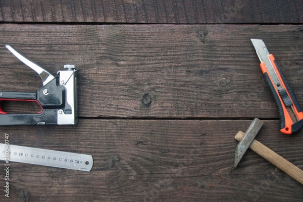 Fototapeta Building tools on the dark wooden table. Top view, flat lay. Copy space