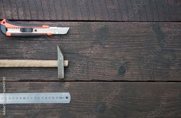 Fototapeta Flat lay of a building tools on a dark wooden table. Woodwork and DIY concept. Copy space