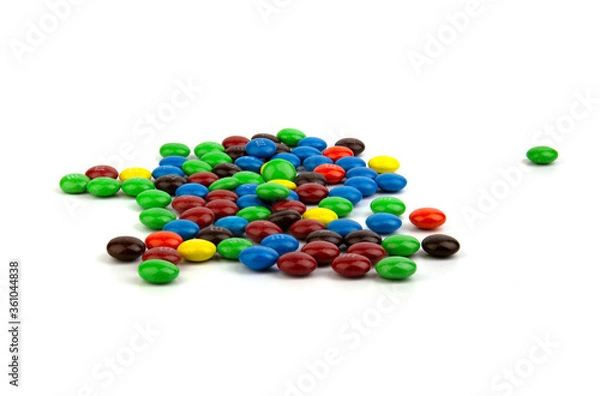 Fototapeta Suratthani Thailand - June 29, 2020: M&M's candies. M&M's produced by Mars, Incorporated. Close up of a pile of colorful chocolate coated candy, chocolate pattern, candies background