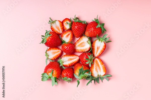 Fototapeta Fresh tasty strawberries on a pink background. Summer concept. healthy eating concept. Concept of a supermarket, market, or grocery store. closeup, top view, flat lay.