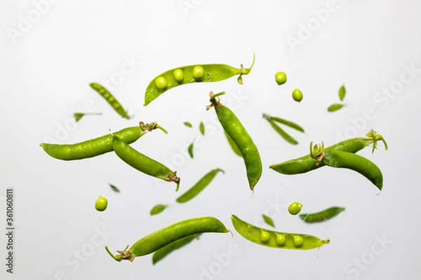 Fototapeta Flat lay composition with delicious fresh green peas levitating on white background