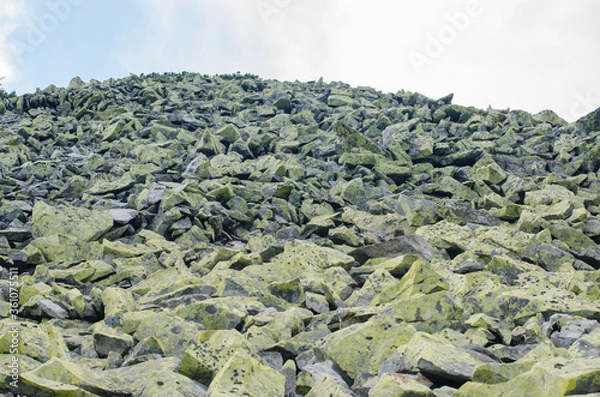 Fototapeta Hike to the high mountains at the top many stones