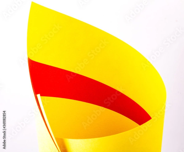 Fototapeta Red yellow paper on a white isolated background