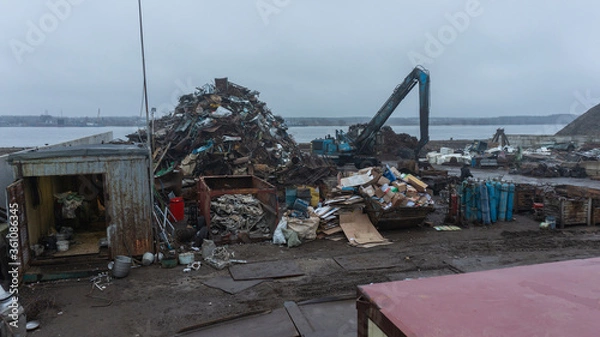 Fototapeta Reception and dispatch port for ferrous metal with loading cranes near the river