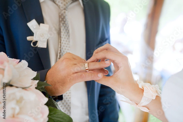 Fototapeta bride and groom holding hands