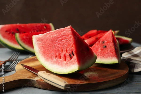 Fototapeta Composition with watermelon slices on gray wooden table. Summer fruit