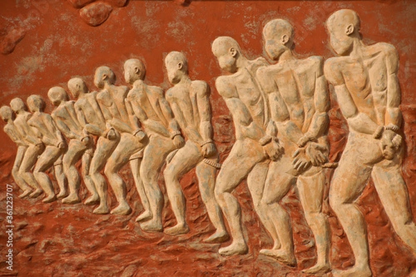 Fototapeta Chained slaves relief on Door of No Return memorial, Ouidah, Benin