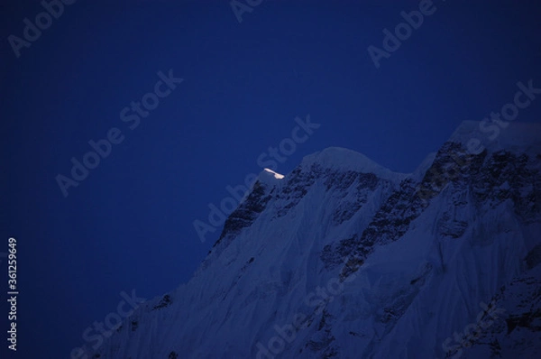 Obraz snow covered mountain at night