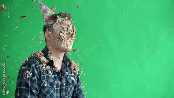 Obraz Throw birthday cake at mans face, he smiles and laughs in slow motion