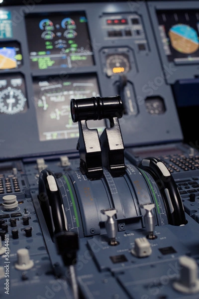 Fototapeta Control aviation panel of plane in cockpit. Plane cockpit with many function to control. Engine control wheel. Aviation dashboard in bussiness aviation.