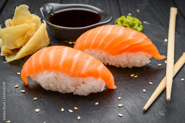 Fototapeta Japanese dish of sushi rice with salmon
