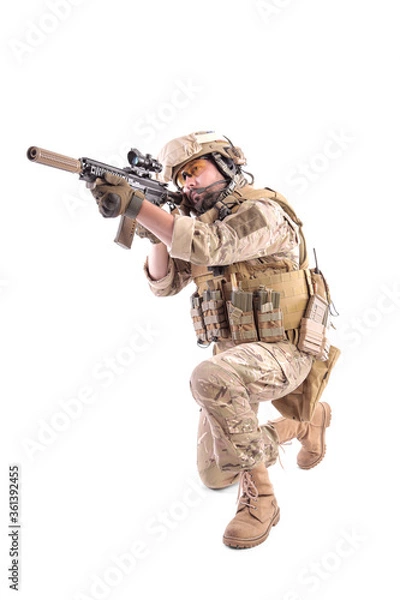 Fototapeta Portrait Of A Soldier Holding Gun against a white background. isolated. u.s. soldier
