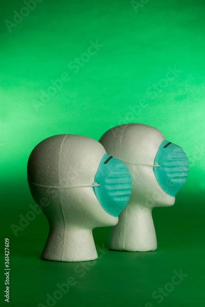 Obraz two white heads with protective blue face masks