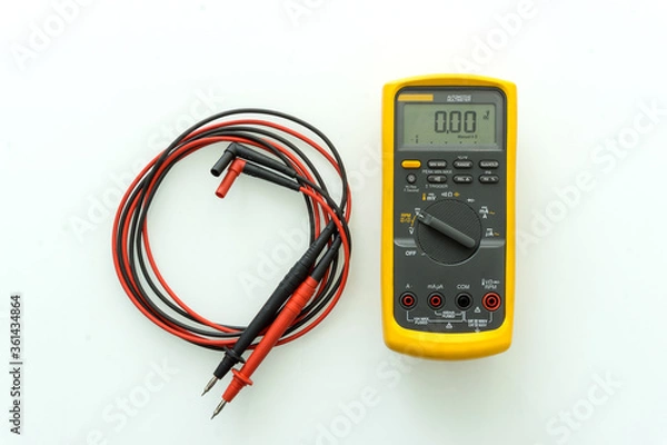 Fototapeta Yellow Digital multimeter with probes for measuring voltage, current, resistance on white background , A multimeter is an electronic measuring instrument.	
