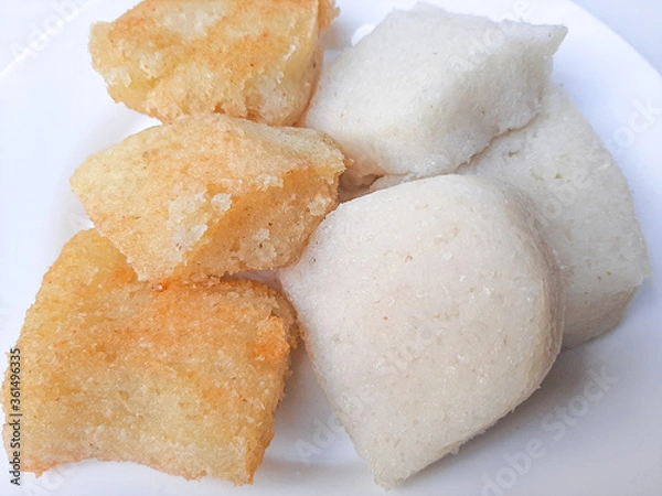 Fototapeta Jadah ketan, is a traditional snack from Indonesia. Made from sticky rice and grated coconut. Comparison before and after fried. On a white plate, isolated in white background