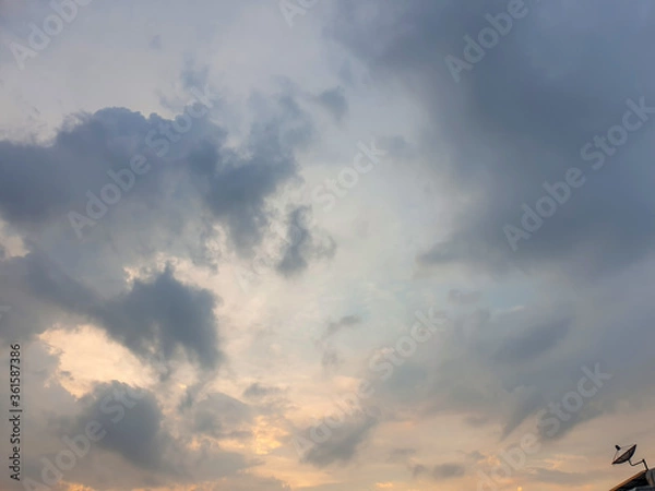 Fototapeta The evening sky with dark clouds, rain preparing to fall. Can see the dish satellite TV
