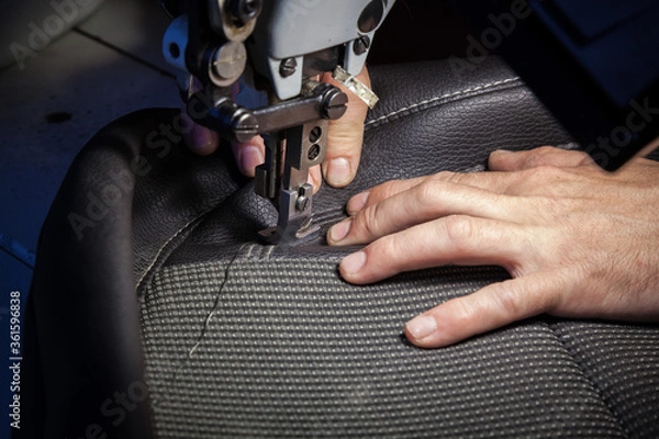 Obraz Tailoring of leather products. Repair of the car seat cover.