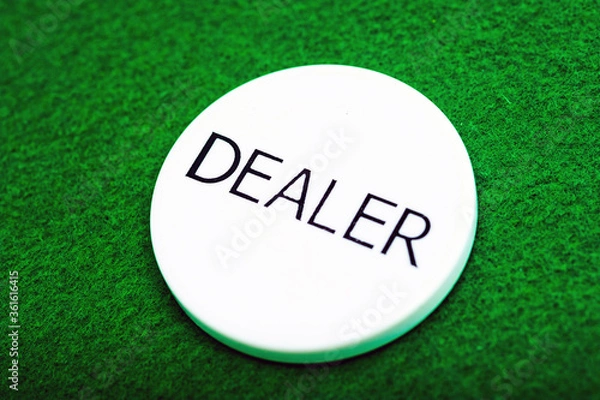 Fototapeta Green background of a poker table with a chip dealer, close-up. Casino.