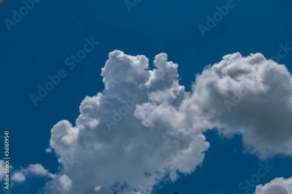 Obraz Clouds in blue sky background with copy space