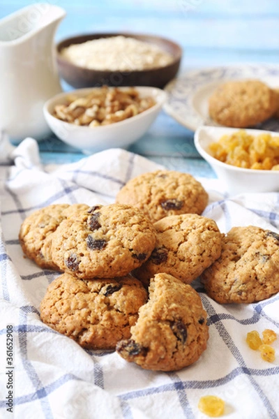 Fototapeta Oatmeal cookies with raisins and walnuts